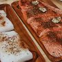 Soak cedar planks in water for 4-6 hrs. Brush olive oil on planks before placing fish. Potlach Seasoning is sprinkled on fish.